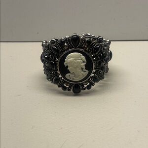 Vintage victorian cameo cuff style bracelet with black gemstones.